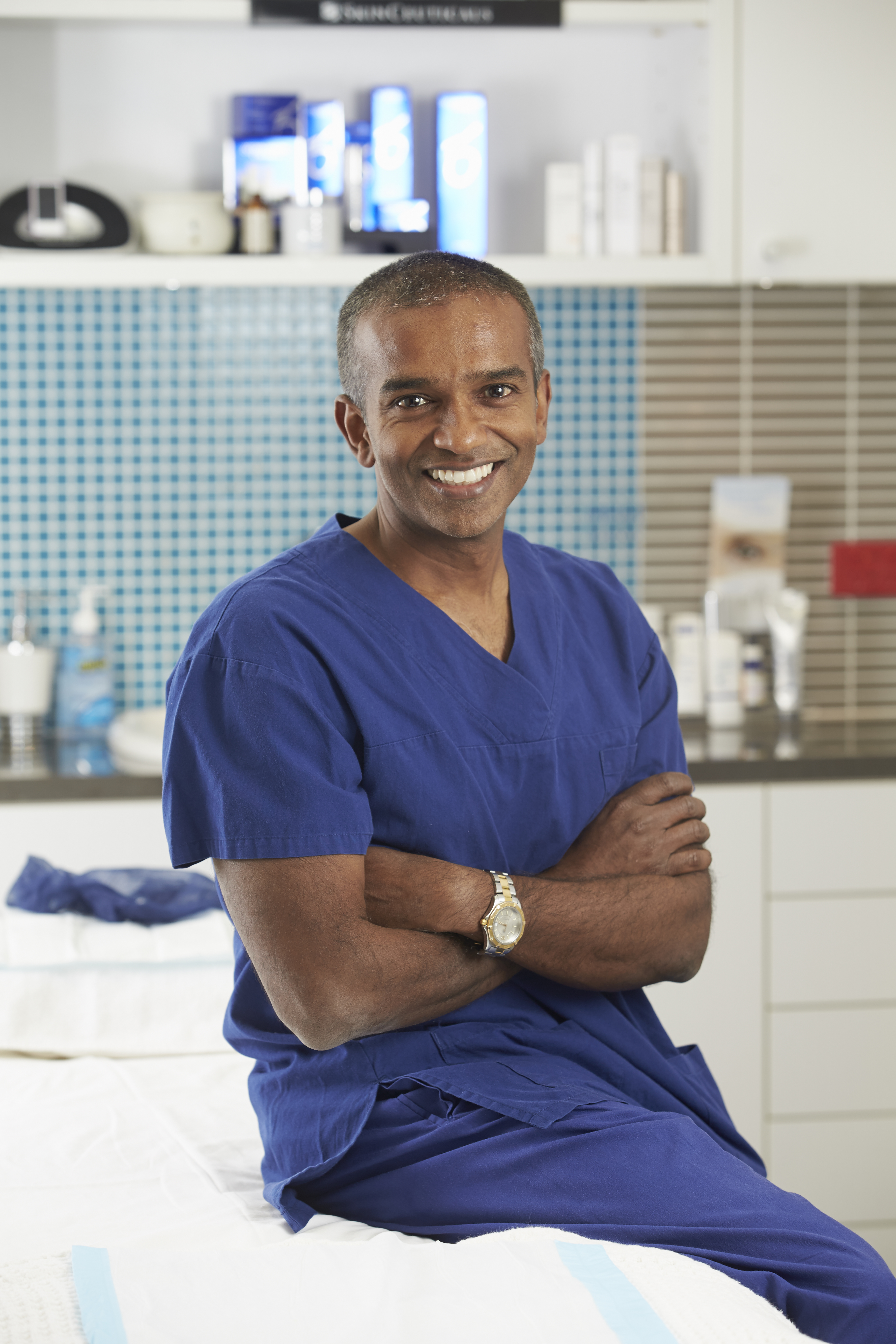 Dr Vij photographed in surgical scrubs